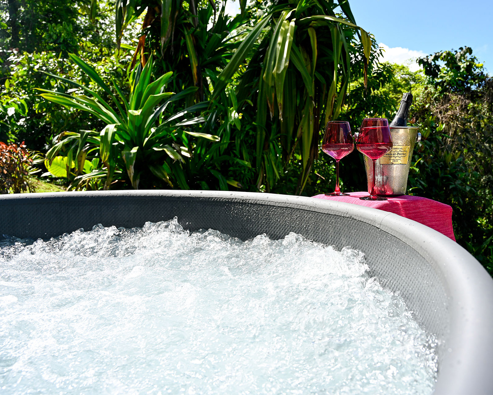 Private jacuzzi with wine and champagne in tropical garden at Hacienda Eterna Primavera Puerto Rico