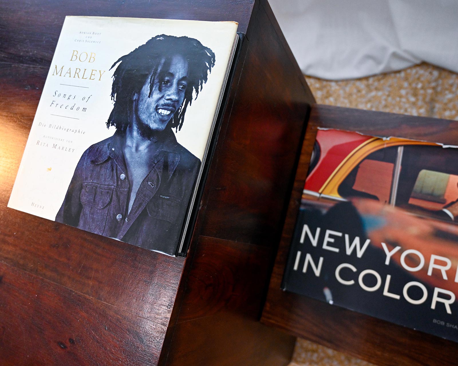 Coffee table with Bob Marley Songs of Freedom book and New York in Color photography book at Hacienda Eterna Primavera